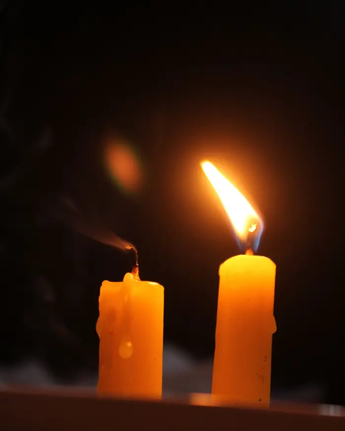Sample image: two candles glowing in a dark room